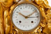 A French Gilt Bronze and Marble Mantel Clock