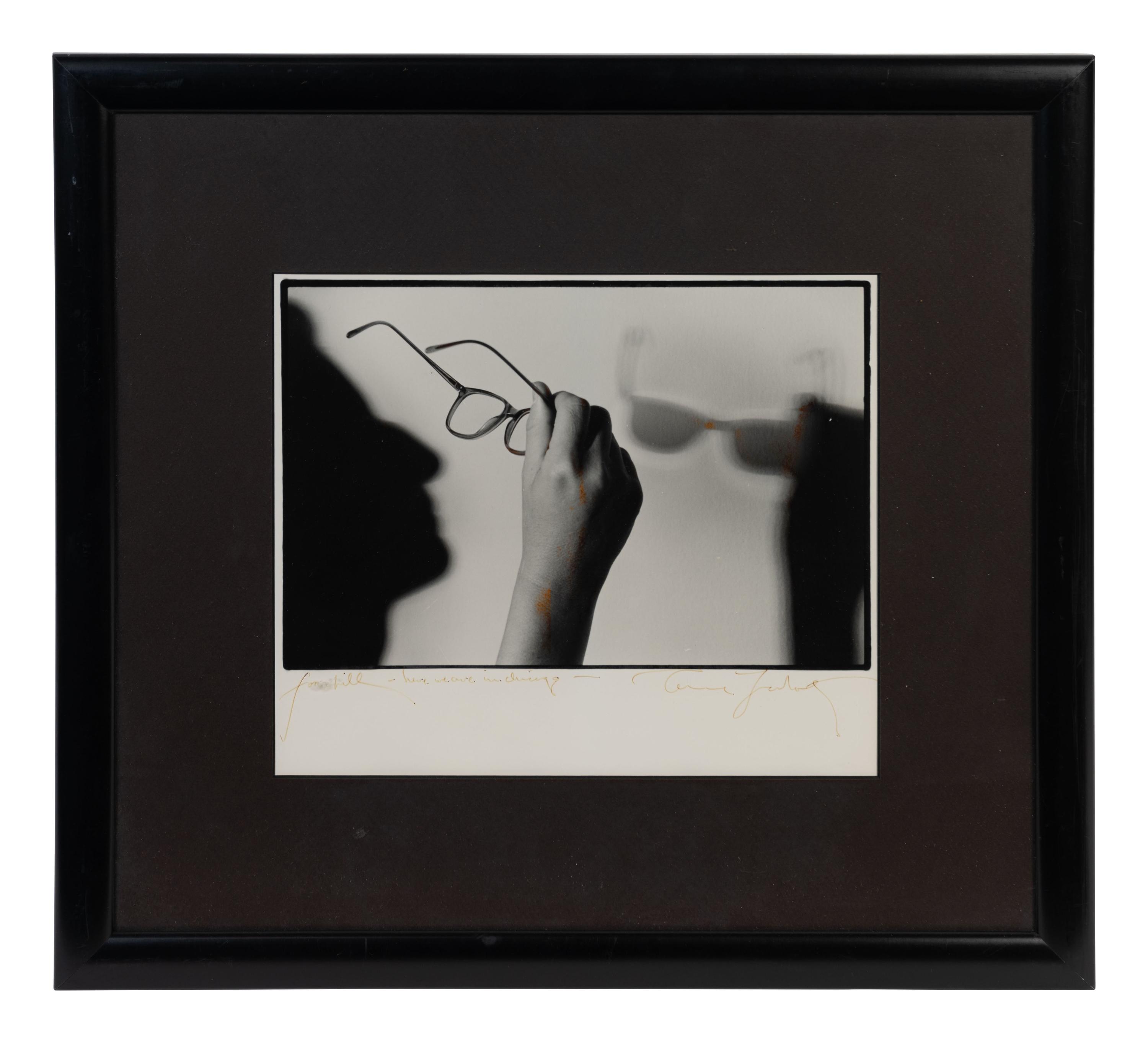 (Celebrity Ephemera) LEIBOWITZ, Annie (1949). Portrait of the artist’s glasses and shadow in profile.