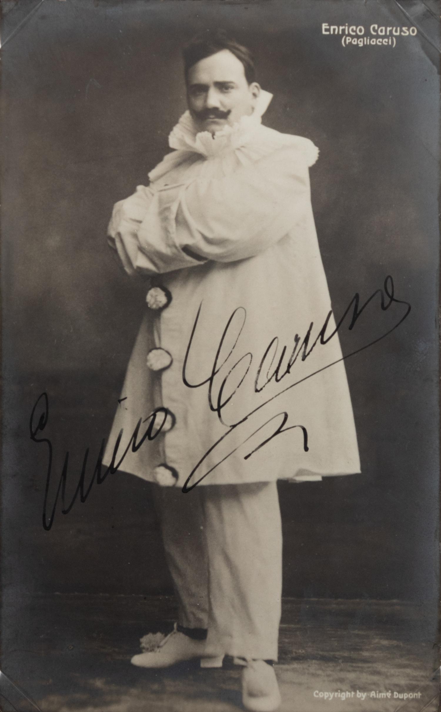 CARUSO, Enrico (1873-1921). Black and white photograph as Canio in Pagliacci , signed ("Enrico Caruso"), by Aime Dupont, n.d.