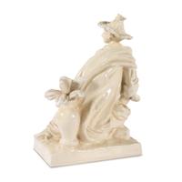 A French White Glazed Faience Chinoiserie Figure