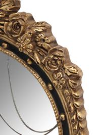 A Pair of Regency Style Ebonized and Parcel-Gilt Mirrors