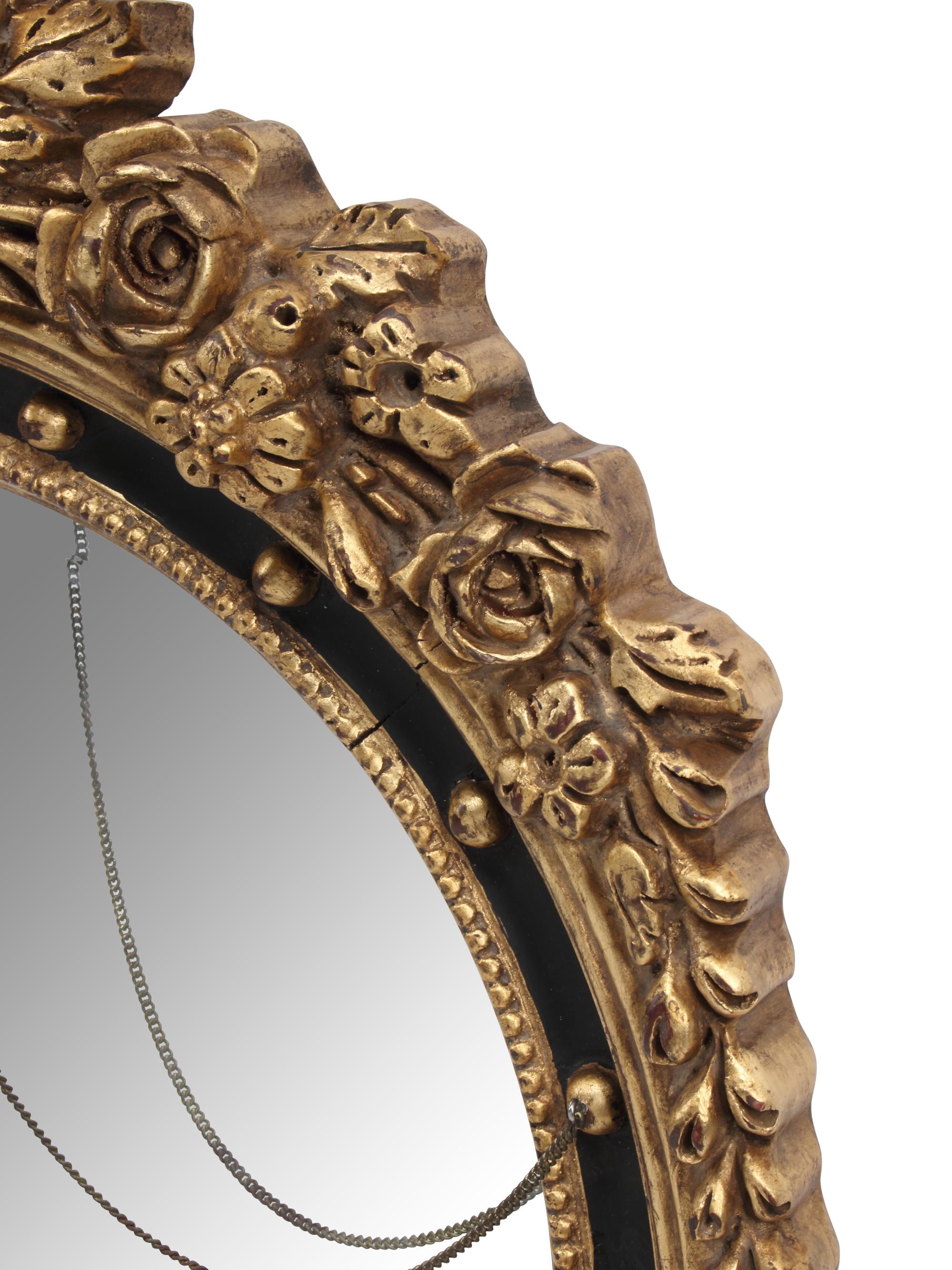 A Pair of Regency Style Ebonized and Parcel-Gilt Mirrors