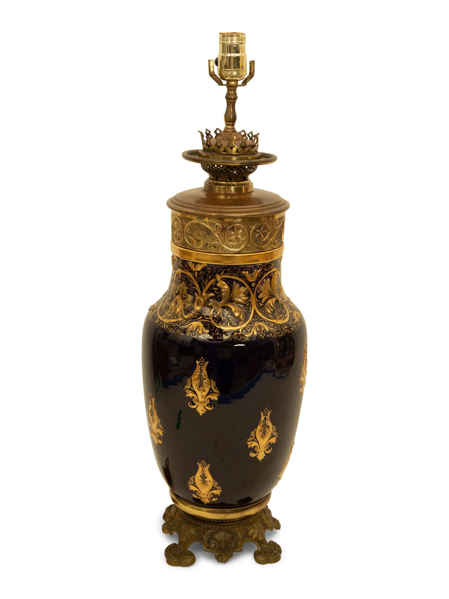 A Gilt Metal Mounted Cobalt and Gilt Decorated Porcelain Table Lamp