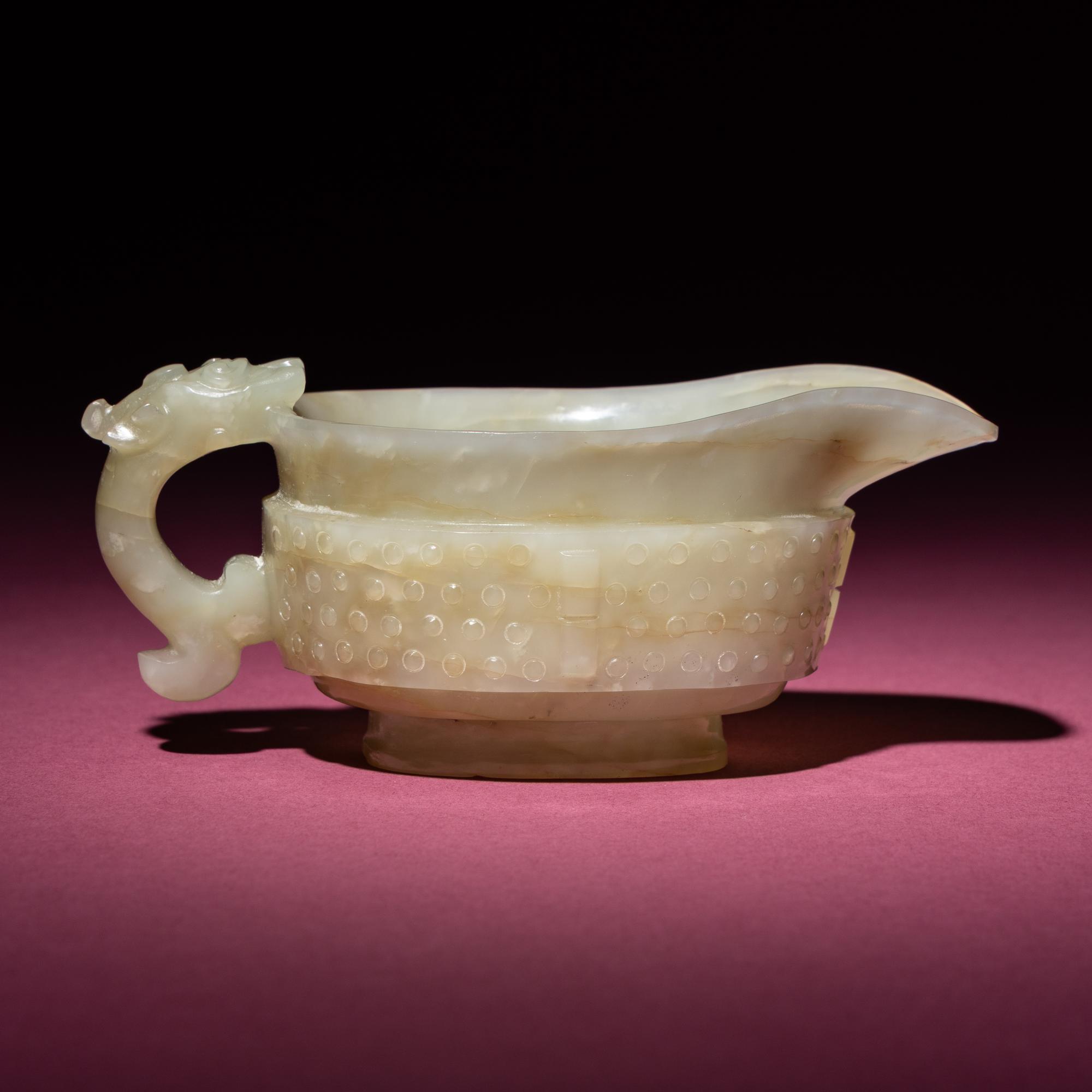 A Chinese Pale Celadon Jade Archaistic Yi Vessel, 17th Century — 清早期 青白玉仿古龍紋匜