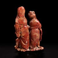 A Chinese carved soapstone figural group