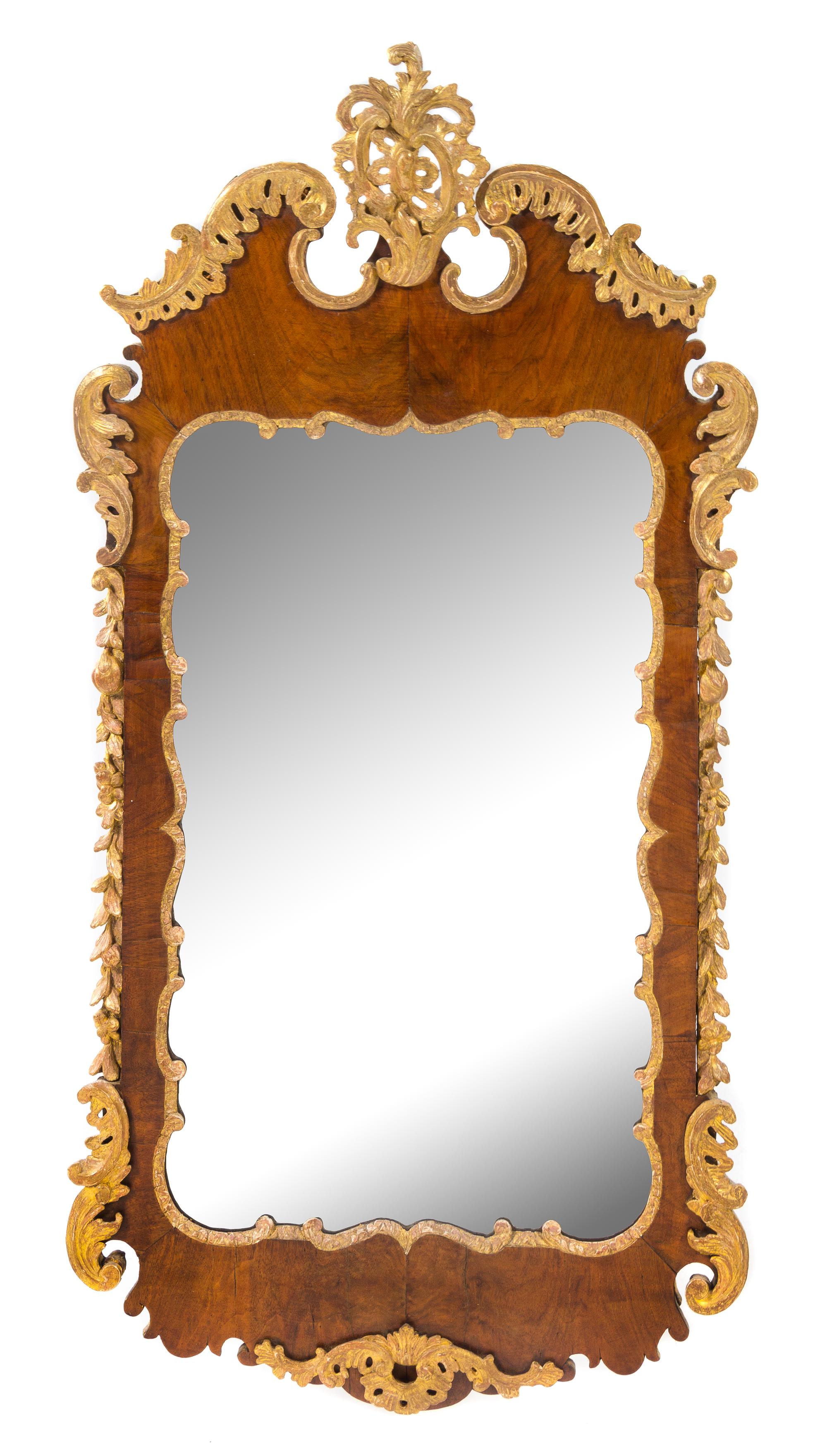 A George II Style Parcel Gilt Mahogany Mirror Height 49 x width 25 inches. — 18TH/19TH CENTURY
