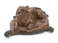 An Italian Carved and Painted Model of a Recumbent Dog