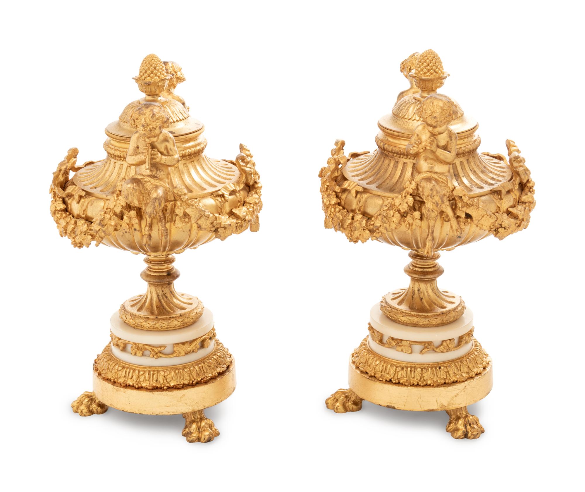 A Pair of Louis XV Style Gilt Bronze and White Marble Covered Urns