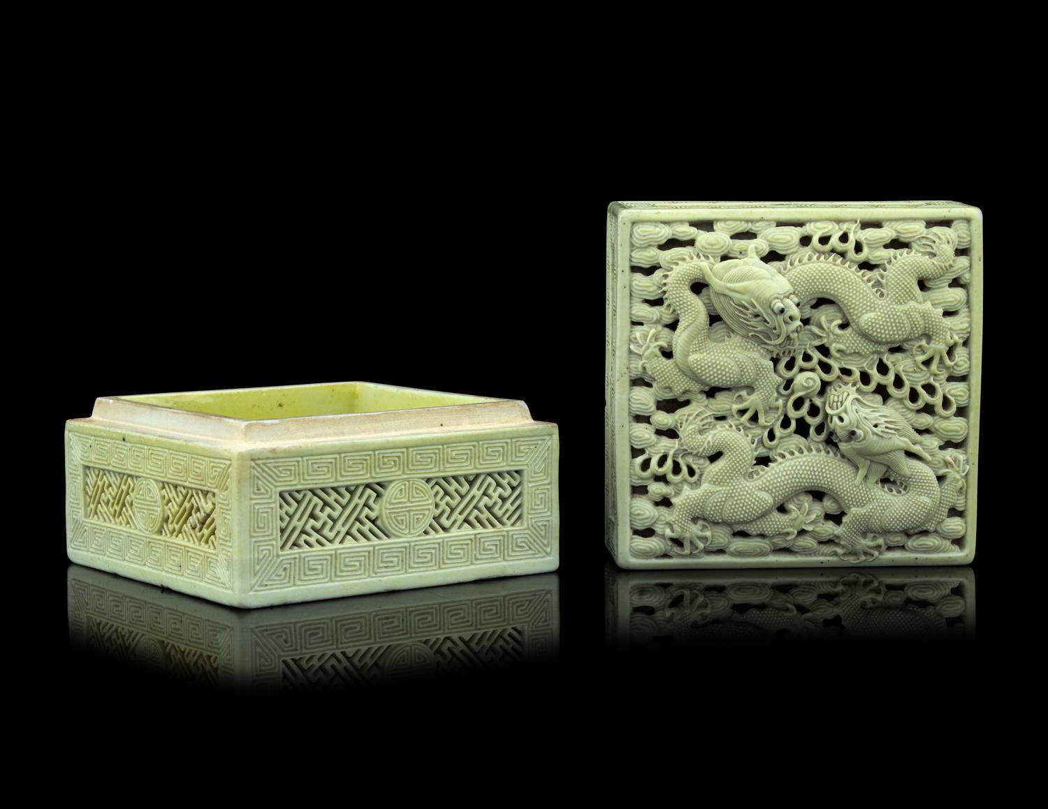 A Carved and Molded Pale Lime Glazed Porcelain 'Dragons' Seal Paste Box and Cover