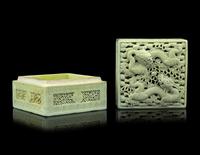 A Carved and Molded Pale Lime Glazed Porcelain 'Dragons' Seal Paste Box and Cover
