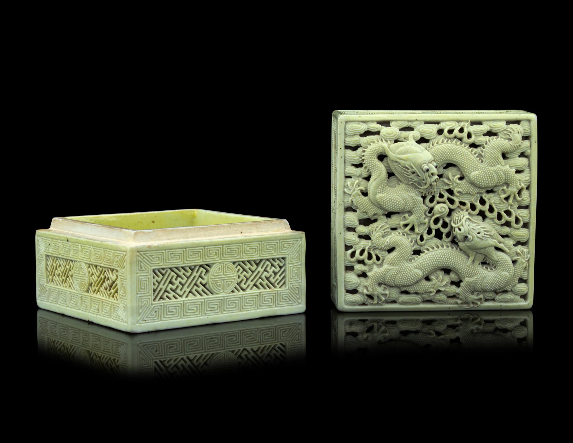 A Carved and Molded Pale Lime Glazed Porcelain 'Dragons' Seal Paste Box and Cover
