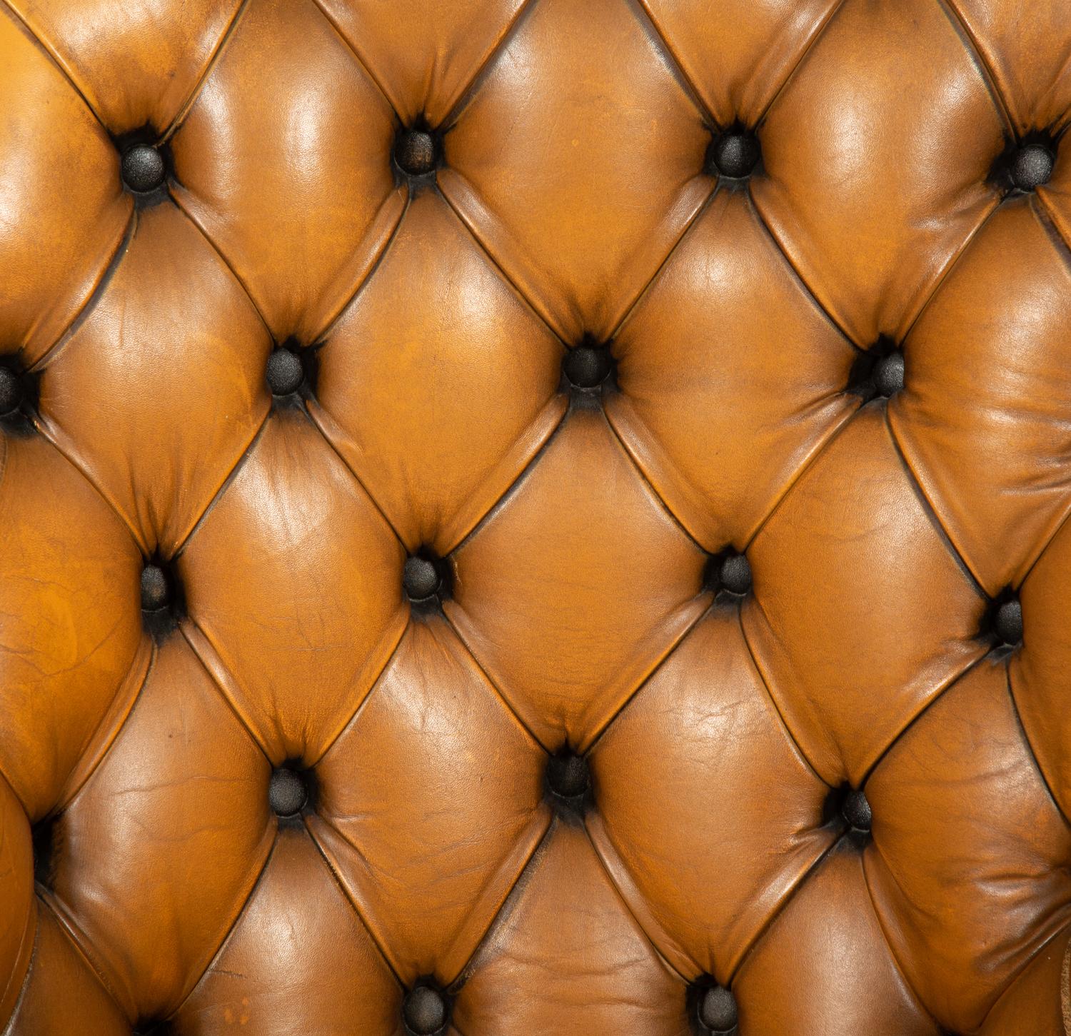 An English Button-Tufted Leather Armchair