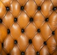 An English Button-Tufted Leather Armchair
