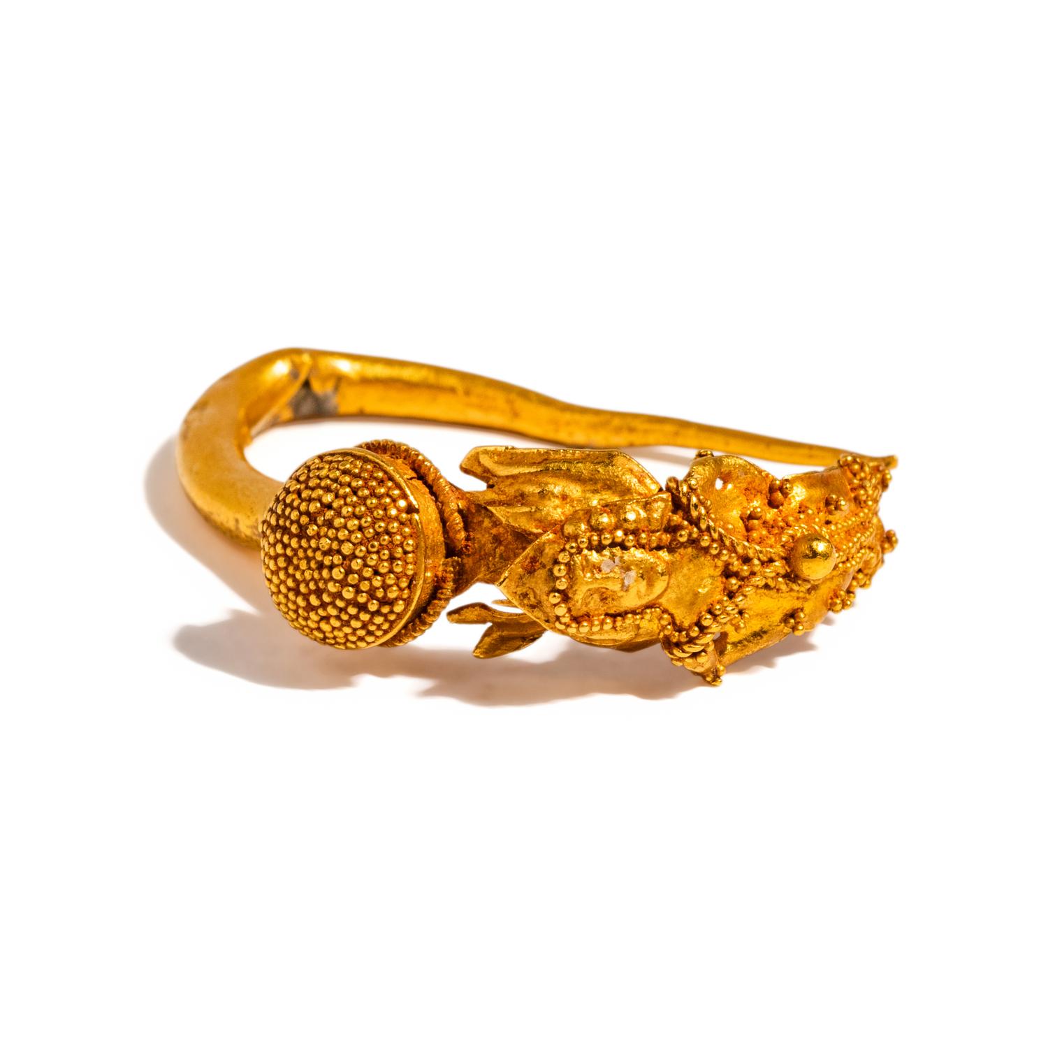 A Greek Gold Earring with Winged Eros