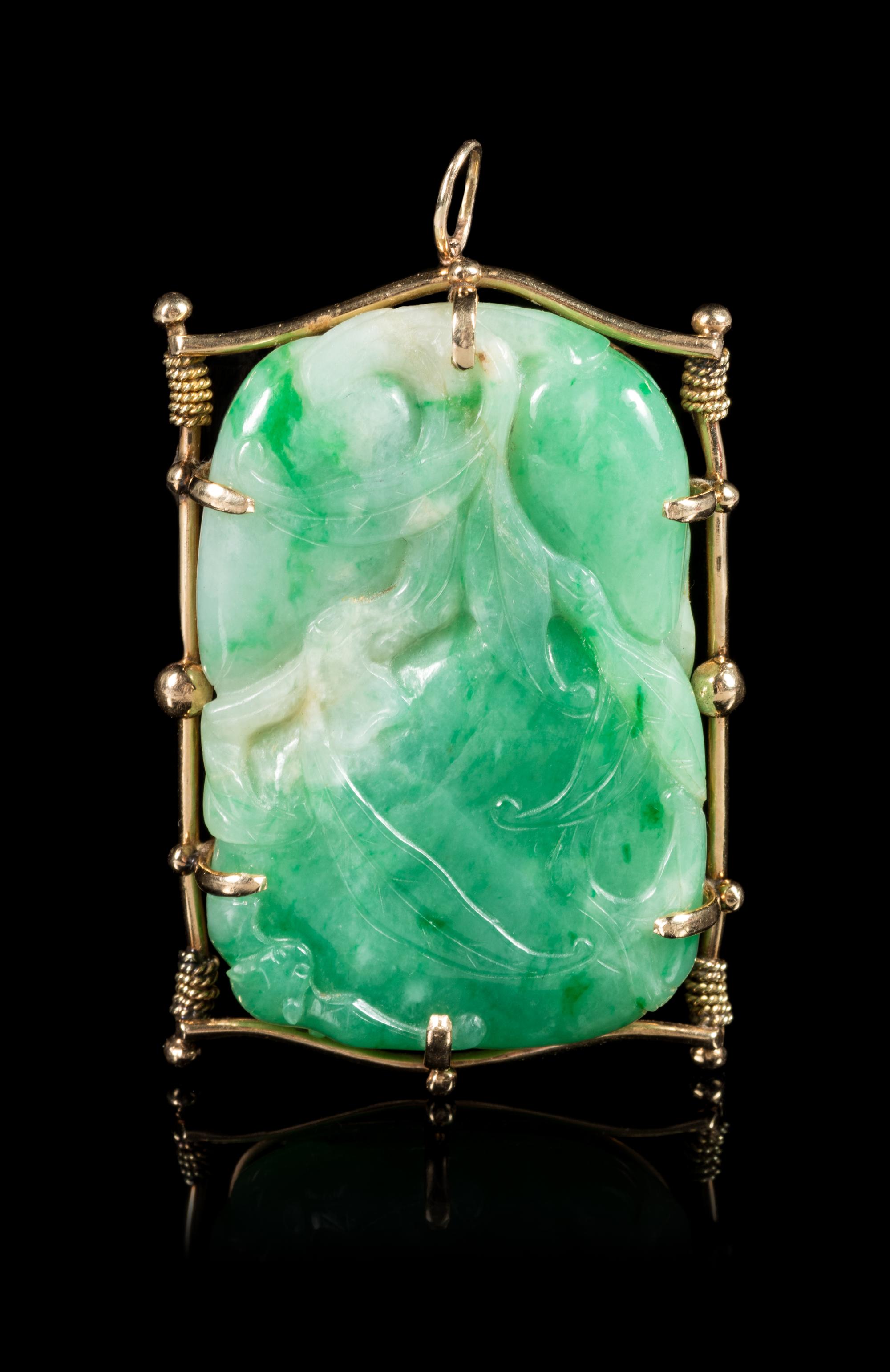 A Gold Mounted Jadeite 'Peach and Bat' Brooch Length 2 1/4 inches.