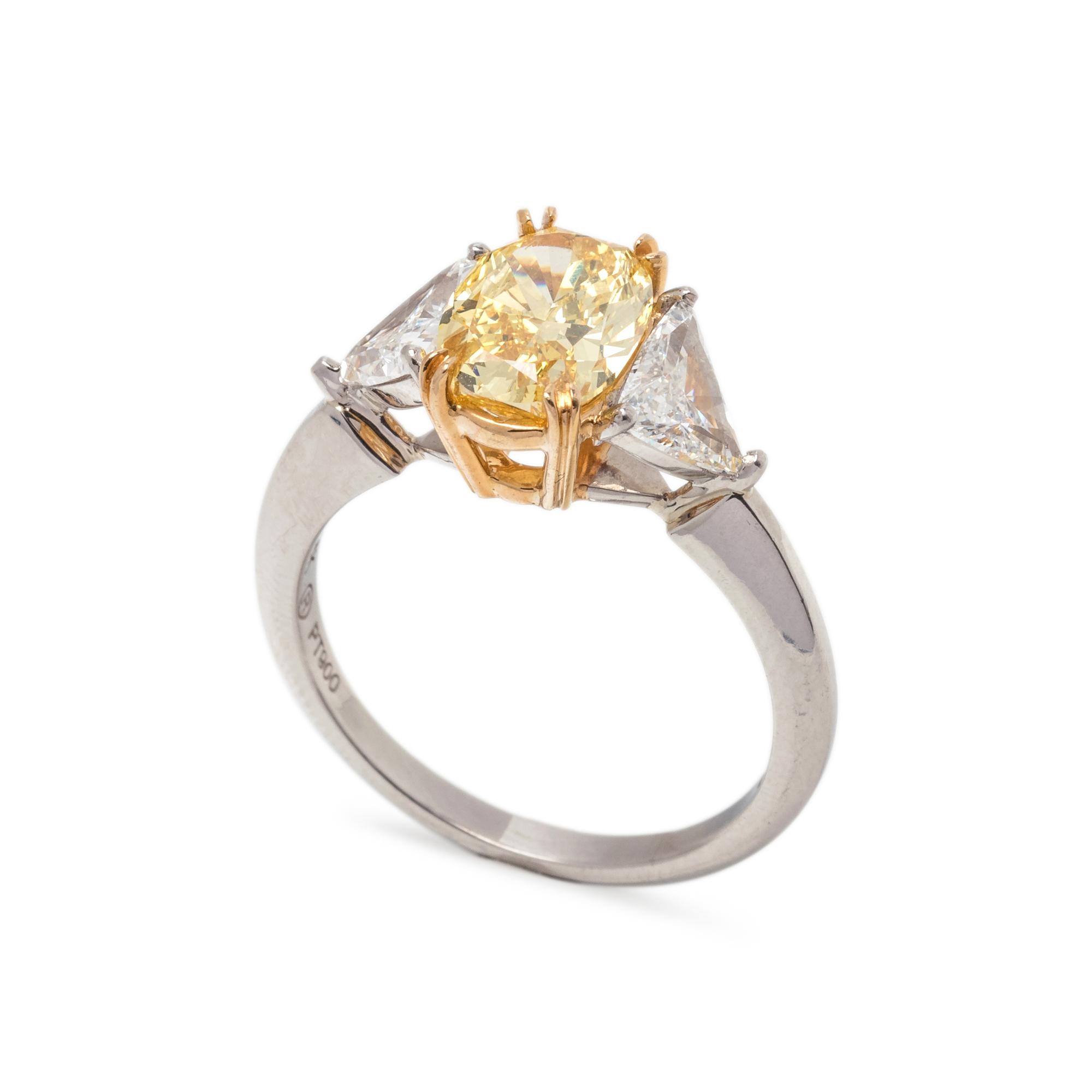 TREATED FANCY INTENSE YELLOW DIAMOND AND DIAMOND RING