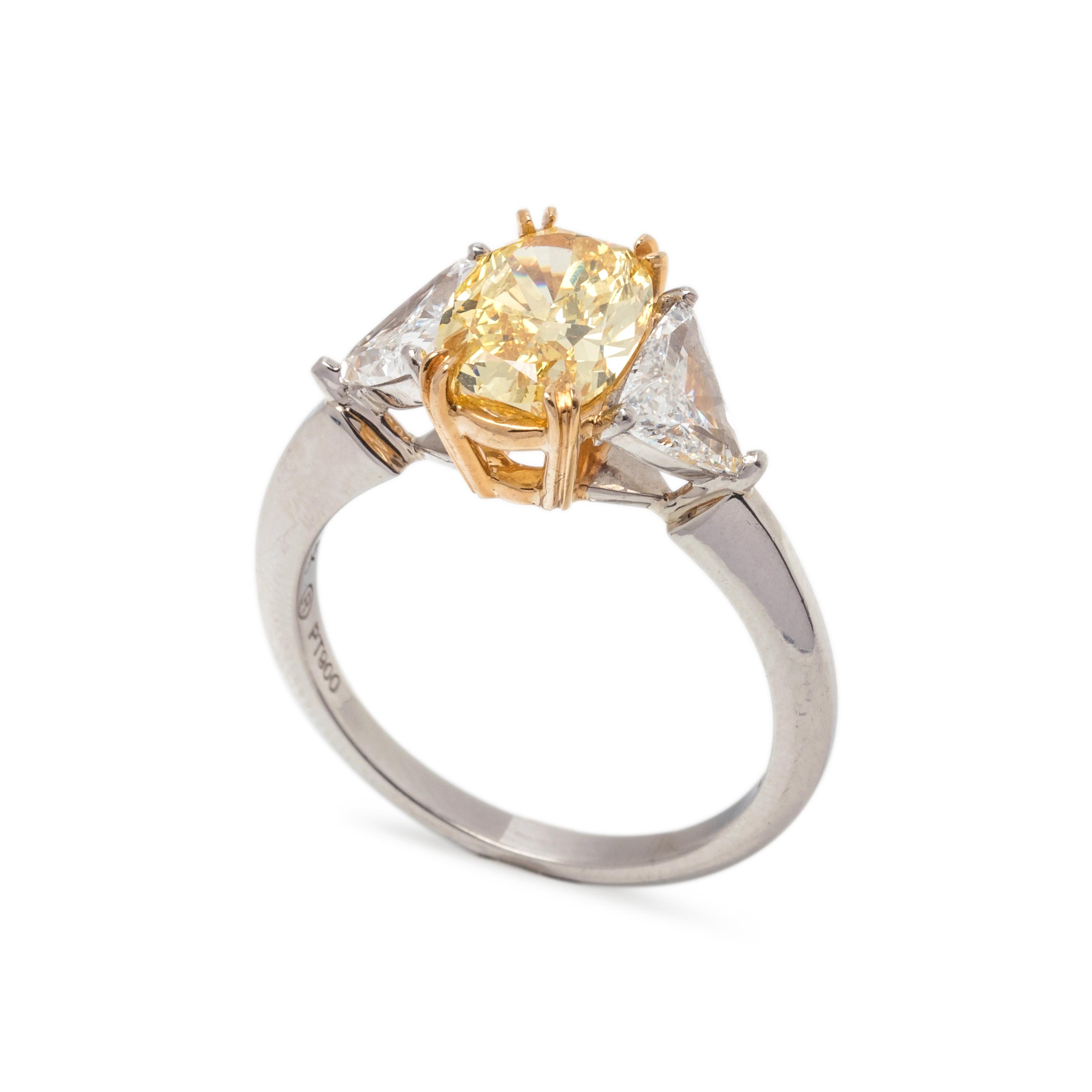 TREATED FANCY INTENSE YELLOW DIAMOND AND DIAMOND RING