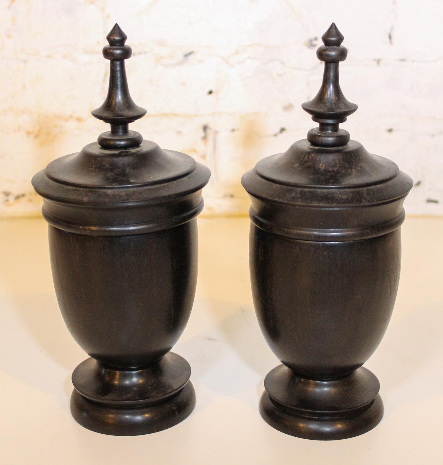 A Pair of Turned Wood Urns. Height 11 inches.