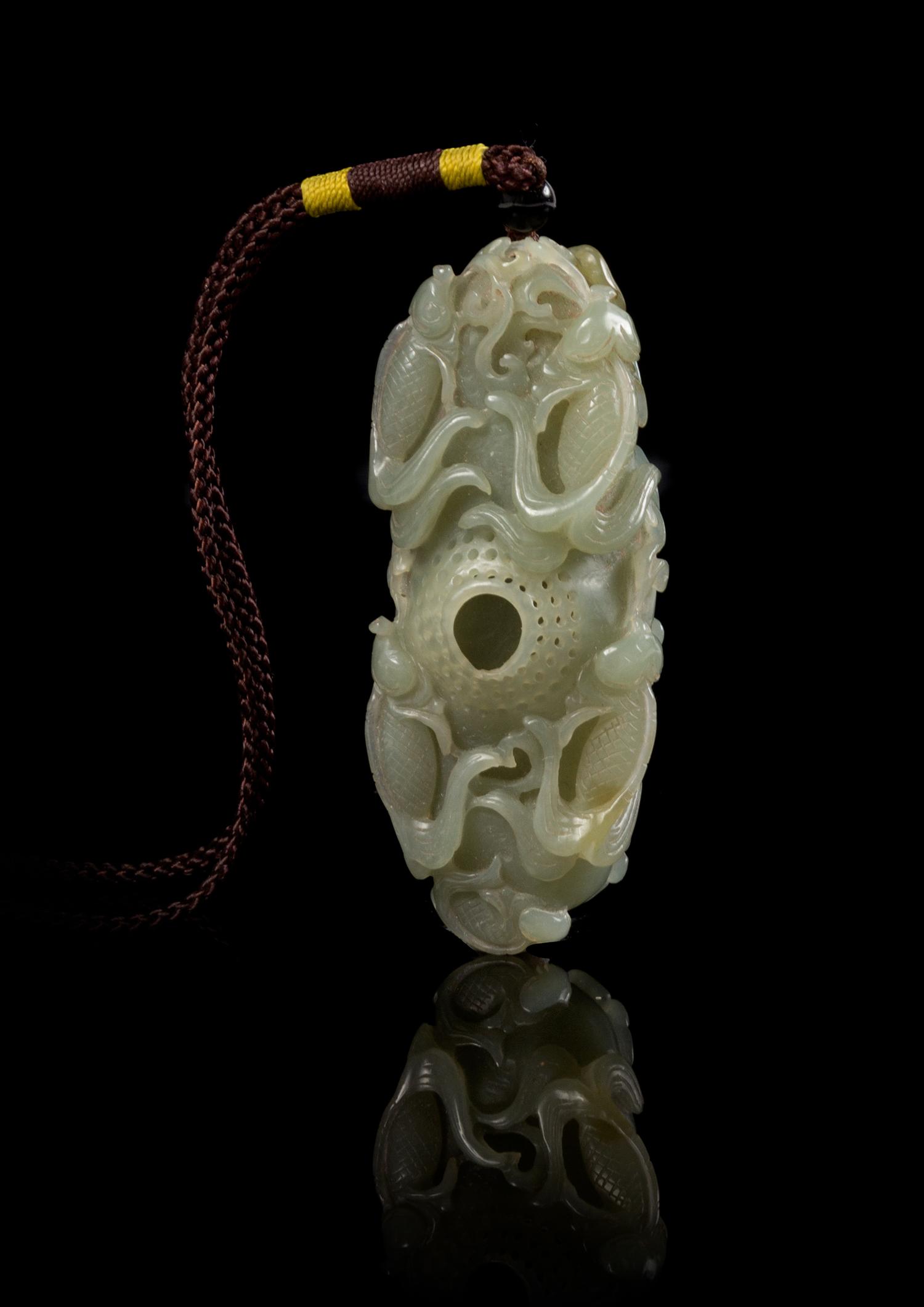 A Carved Jade Toggle Length 2 7/8 inches.