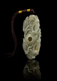 A Carved Jade Toggle Length 2 7/8 inches.