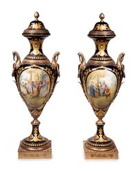 A Pair of Monumental Sèvres Style Gilt Metal Mounted Porcelain Covered Urns on Pedestals