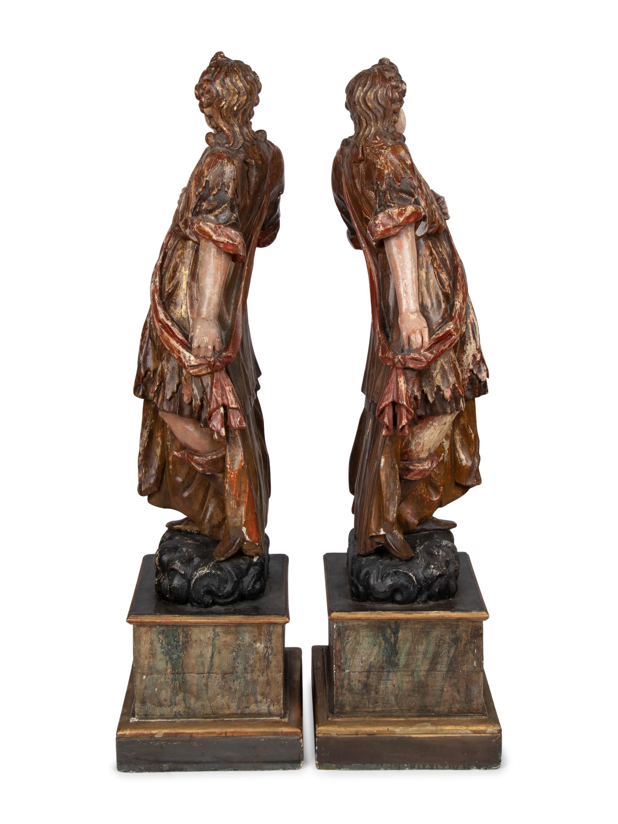 A Pair of Italian Painted and Parcel Gilt Figures of Saints