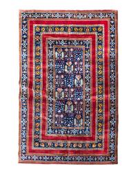 A Persian Wool Rug 9 feet 2 inches x 5 feet 11 inches.