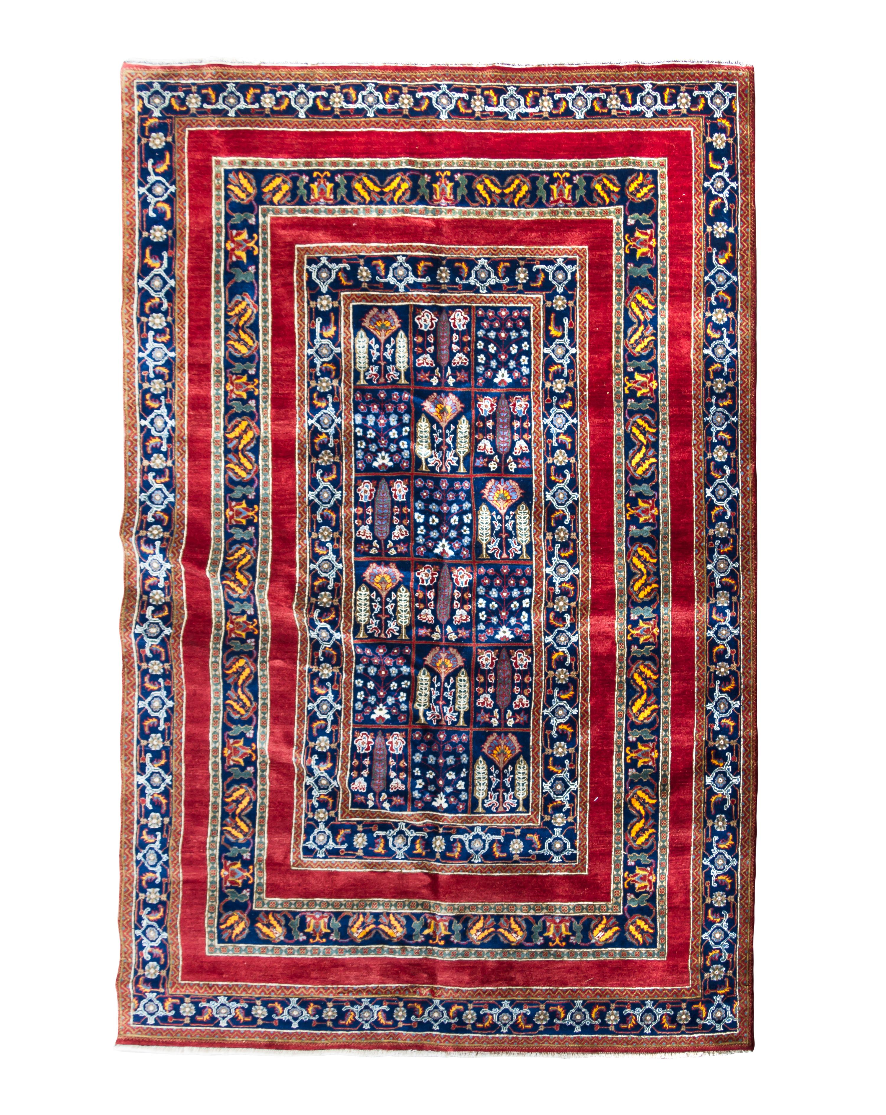 A Persian Wool Rug 9 feet 2 inches x 5 feet 11 inches.