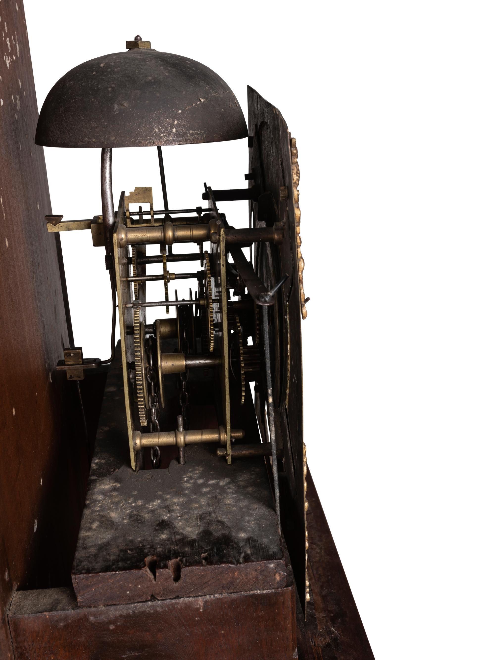 A Queen Anne Walnut Tall Case Clock