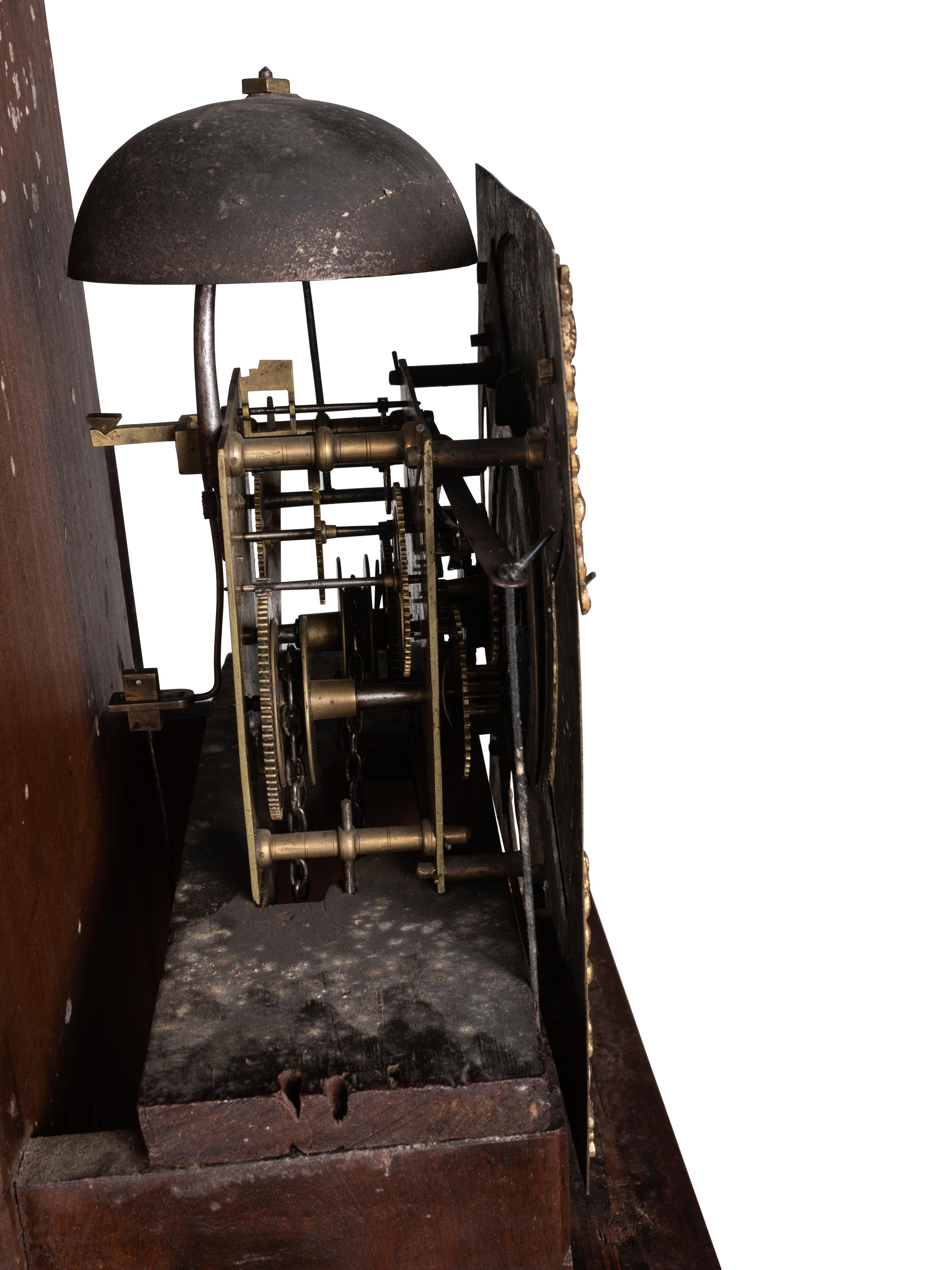 A Queen Anne Walnut Tall Case Clock