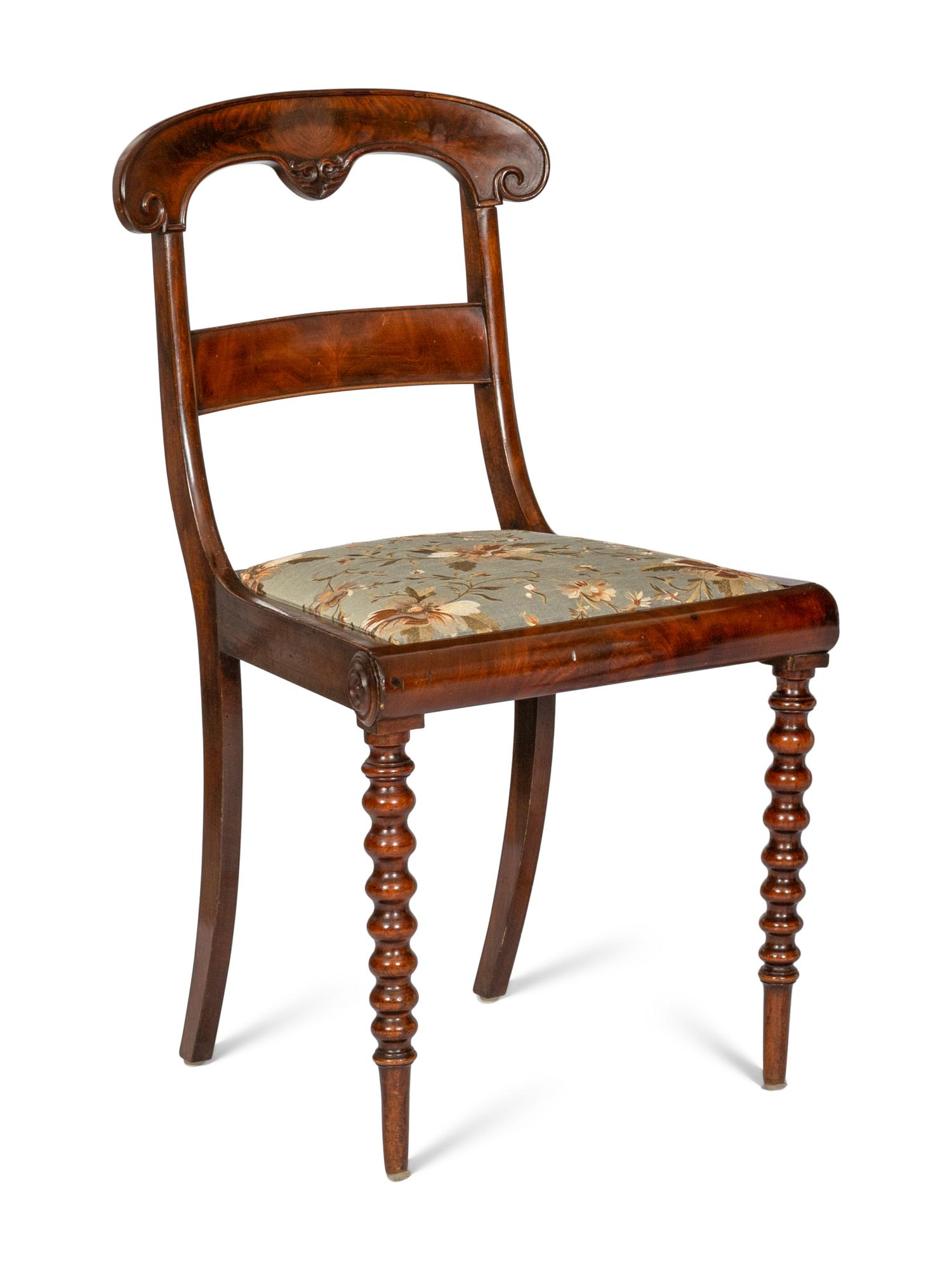 A Continental Mahogany Five-Drawer Writing Desk and Associated Regency Chair