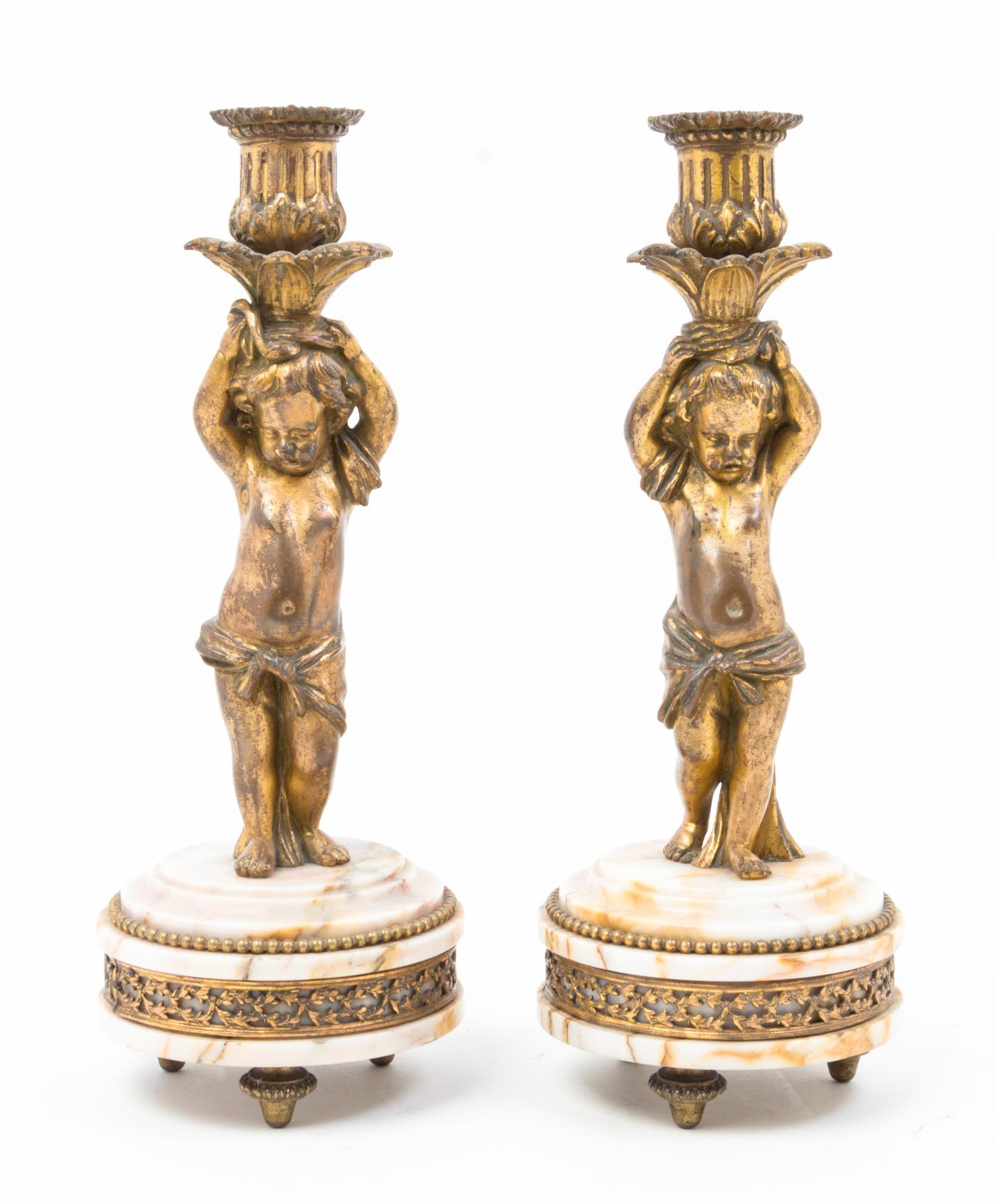 A Pair of French Gilt Bronze and Marble Figural Candlesticks Height 10 3/4 inches.