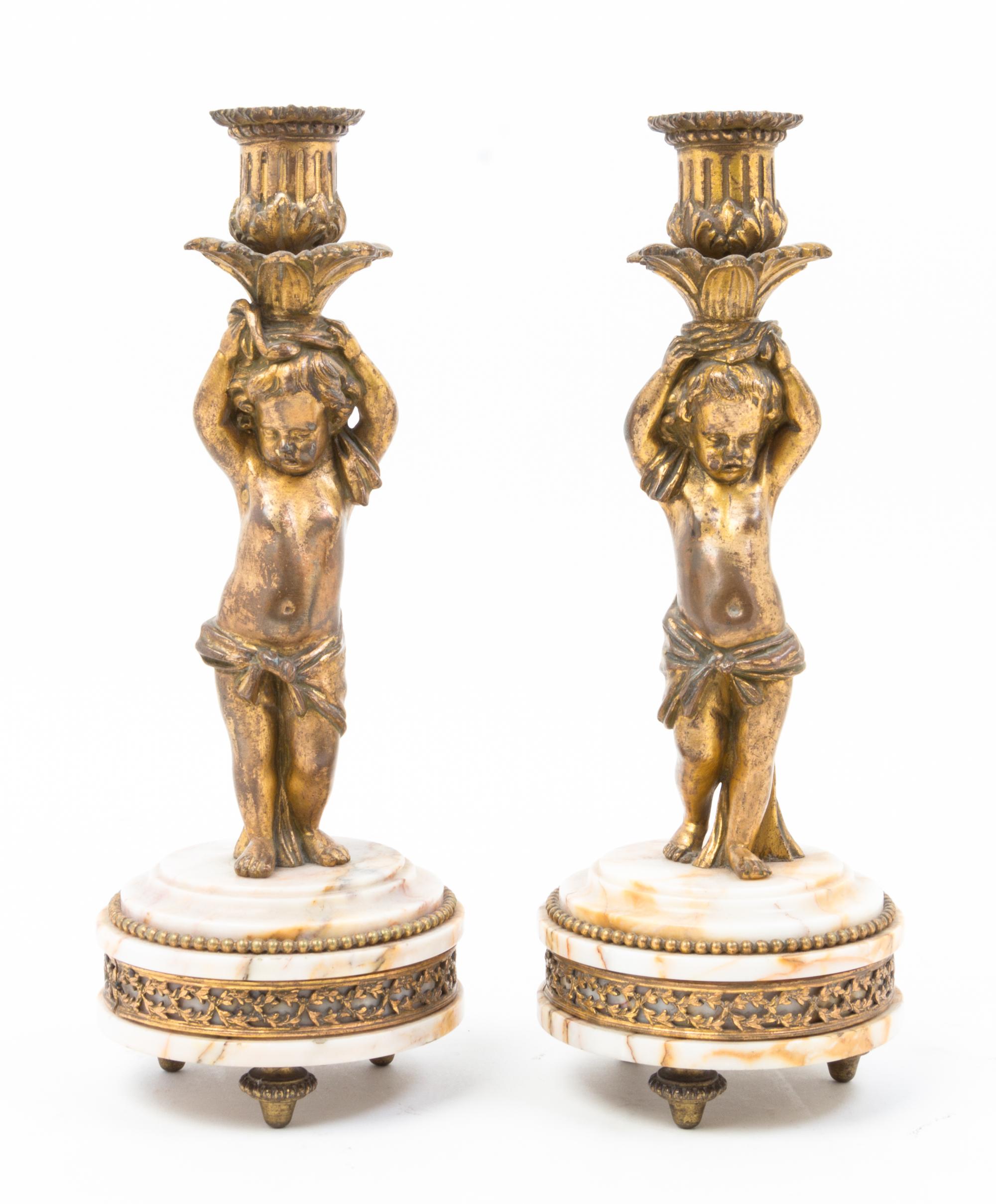 A Pair of French Gilt Bronze and Marble Figural Candlesticks Height 10 3/4 inches.