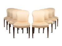 A Set of Eight Saddle Dining Chairs