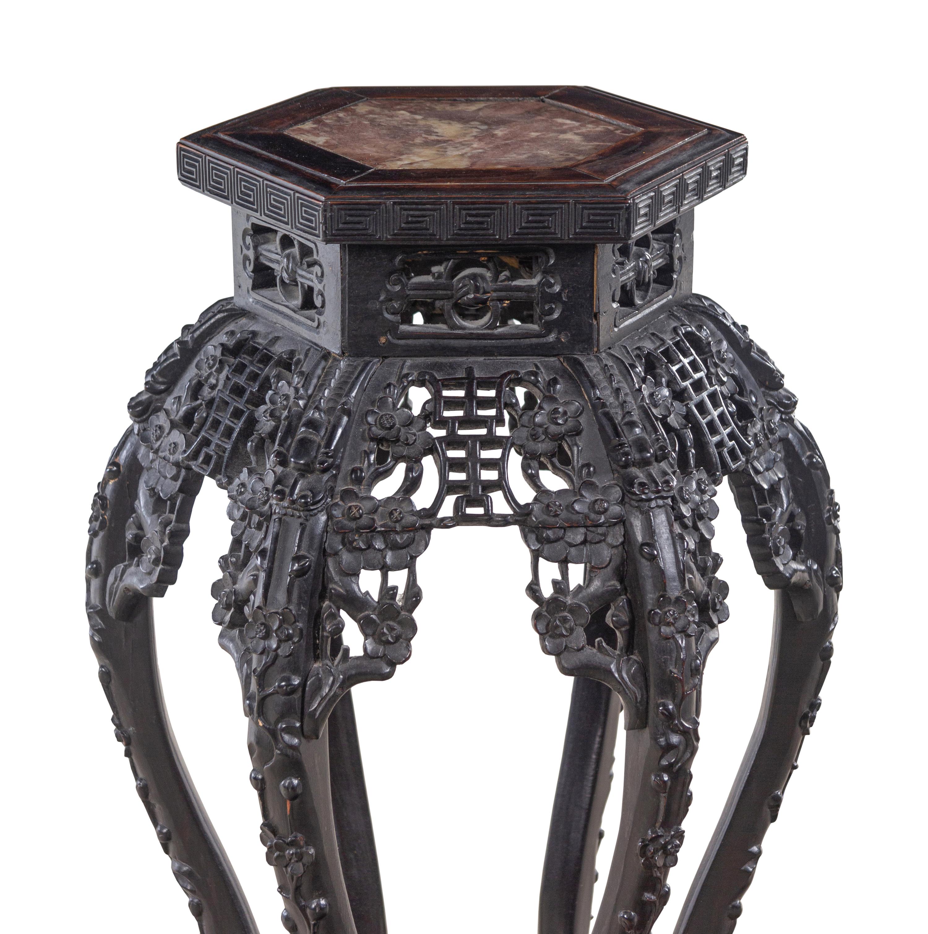 A Chinese Carved Hardwood and Marble-Inset Pedestal Table