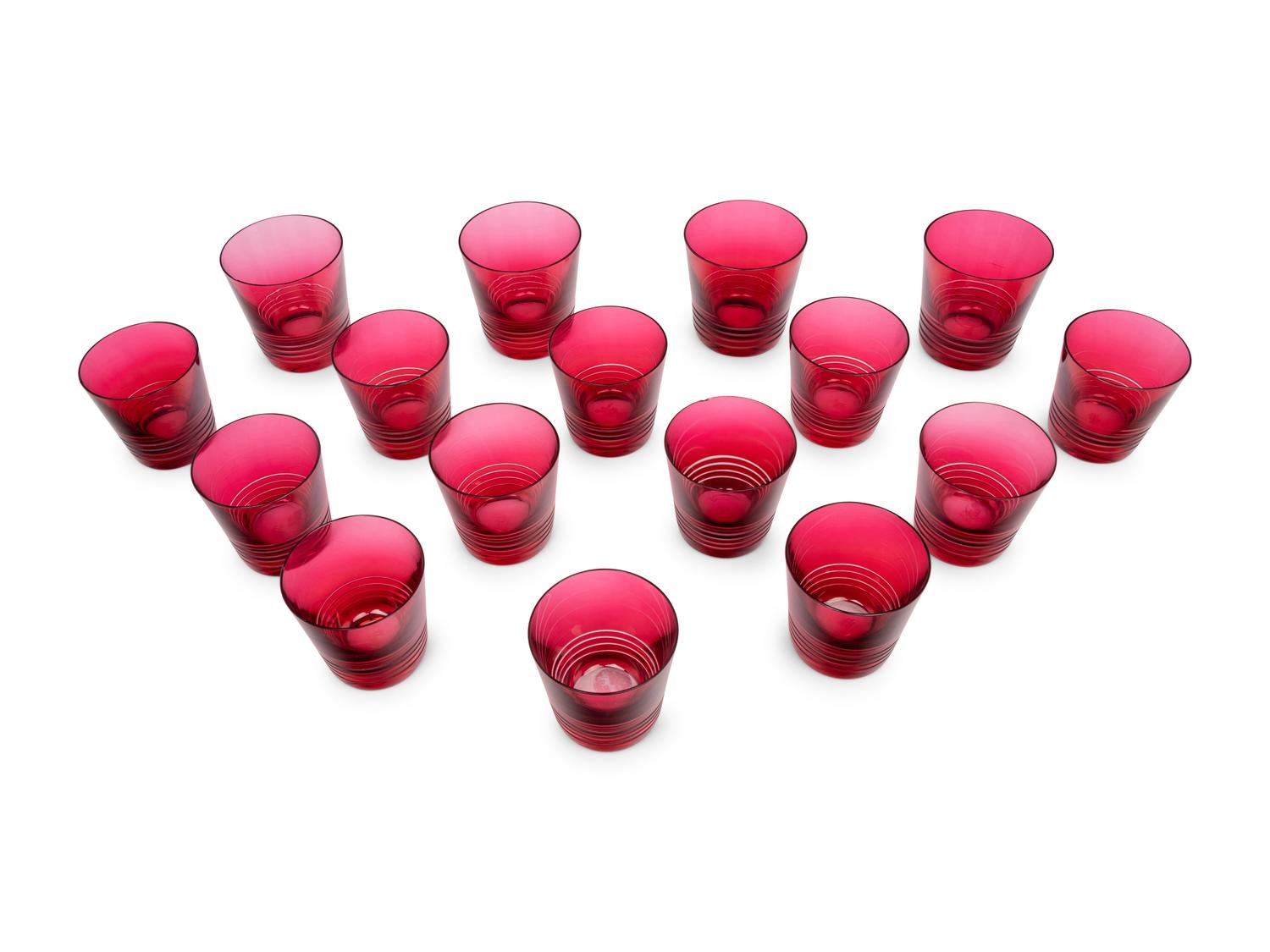 A Set of Sixteen Hermès Attelage Pink Glass Tumblers
