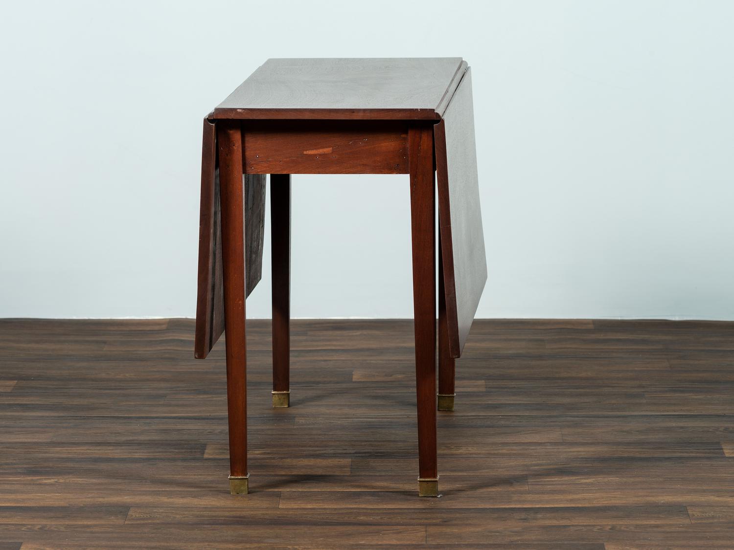 A George III Mahogany Drop-Leaf Dining Table