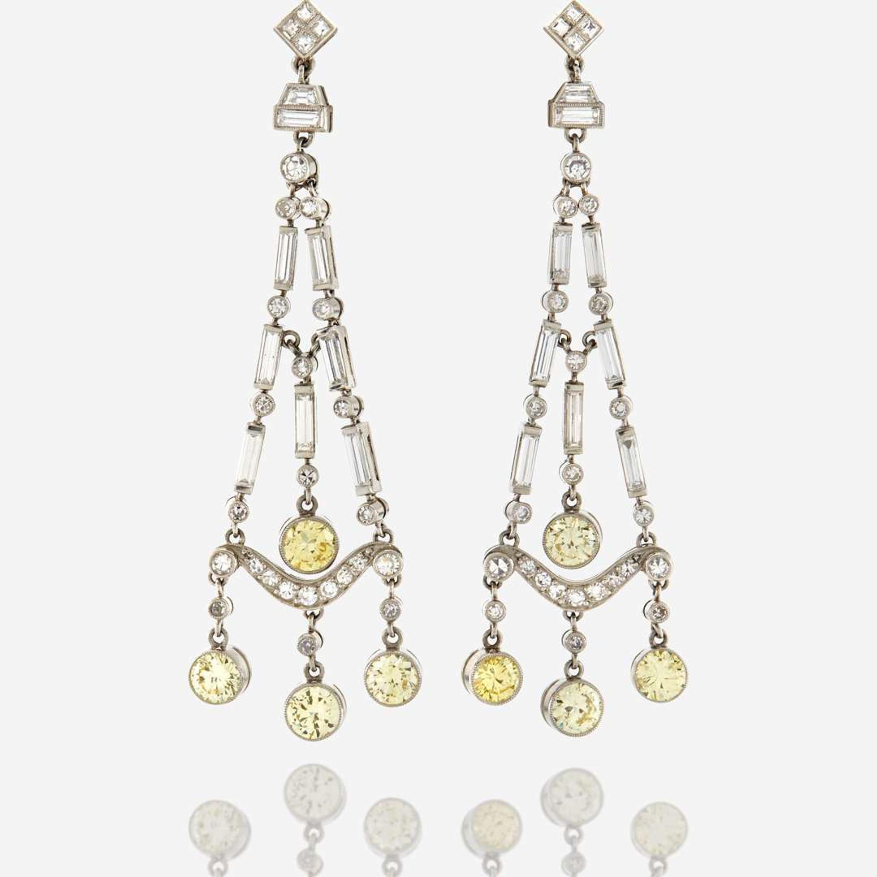 A pair of diamond, colored diamond, and platinum pendant earrings