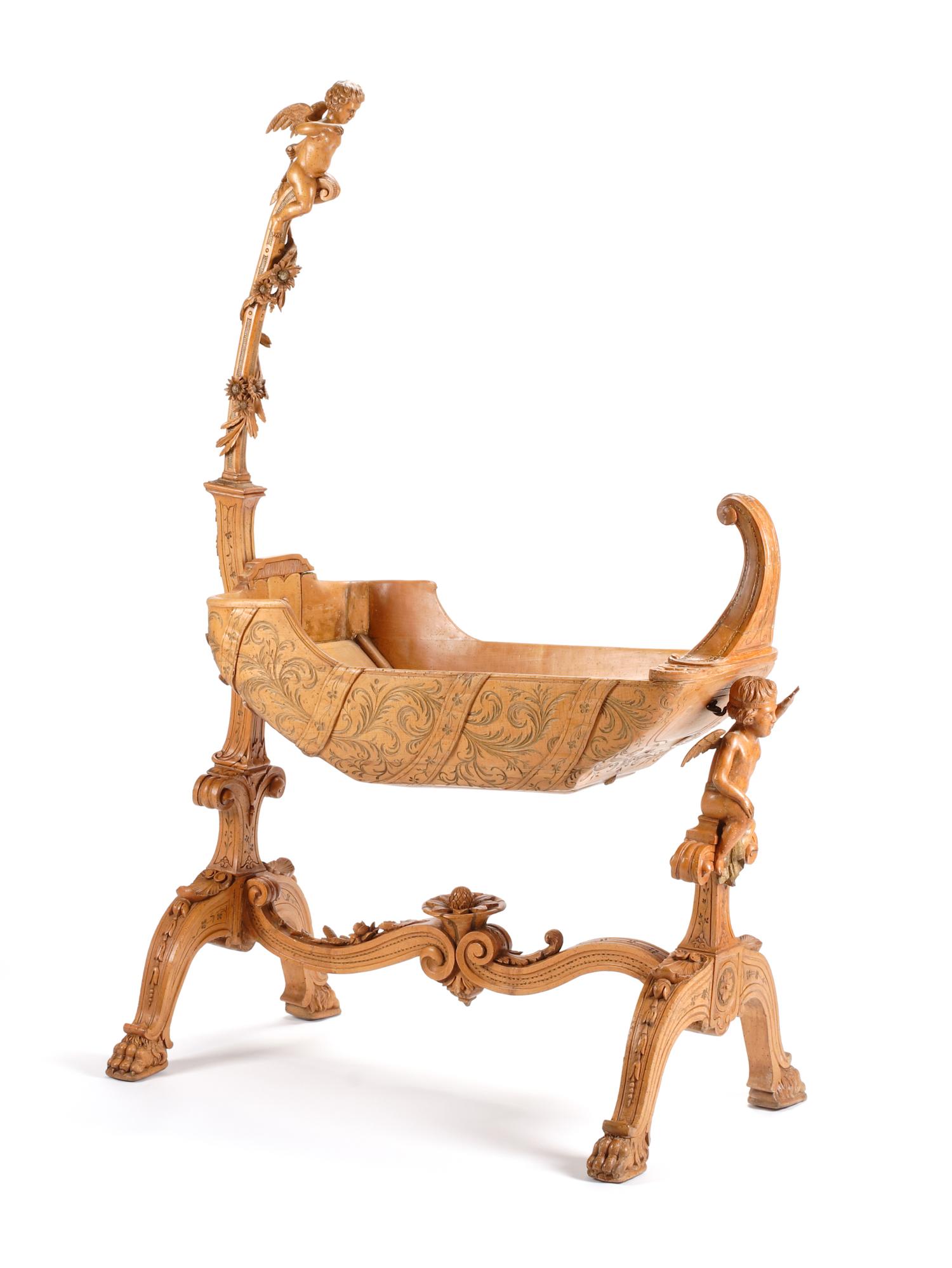 An Italian Carved Cradle Height 66 1/2 x length 41 x depth 18 1/4 inches. — 19TH CENTURY