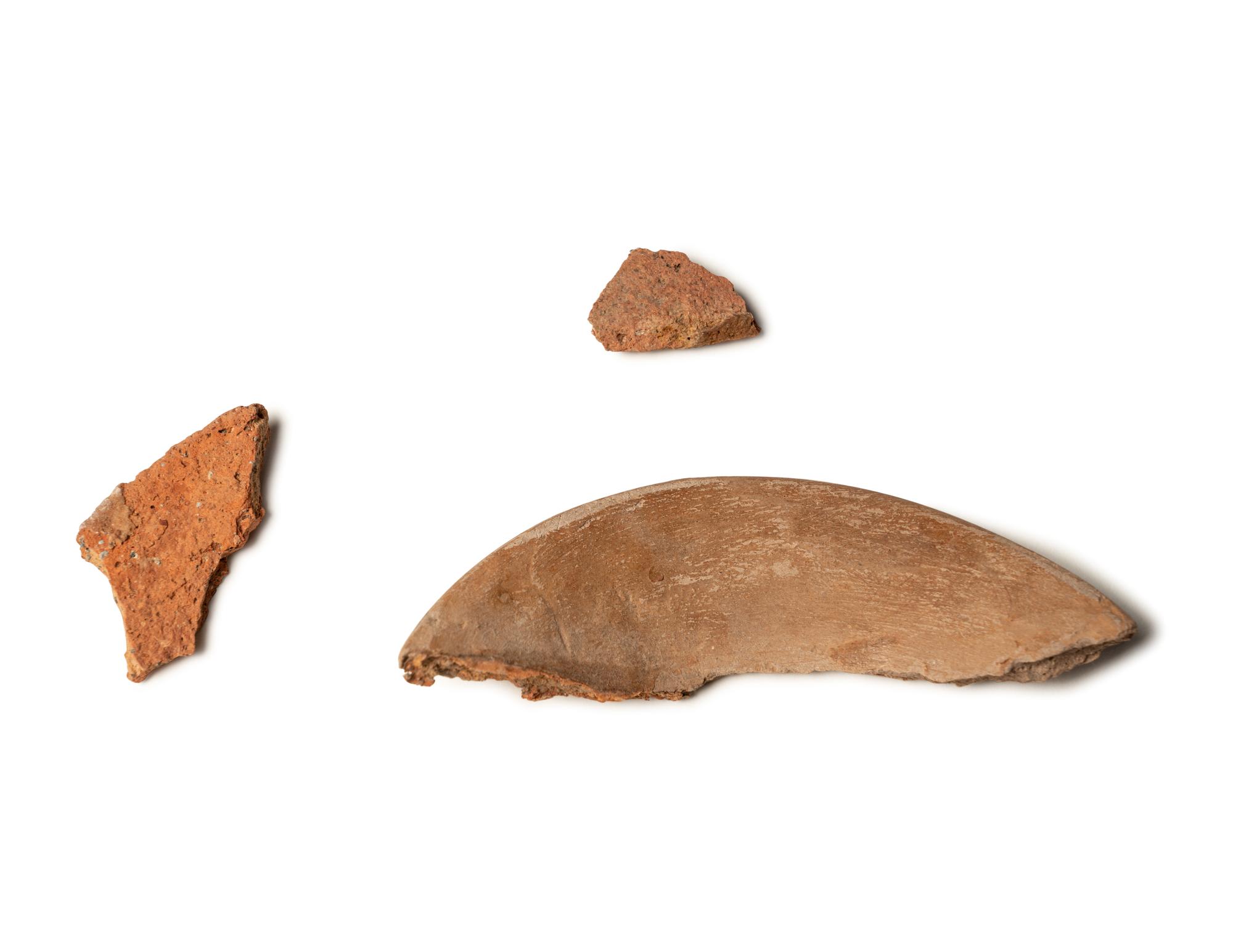 A Group of 19 Holy Land Terracotta Oil Lamps, Pottery, and Bronze Blades