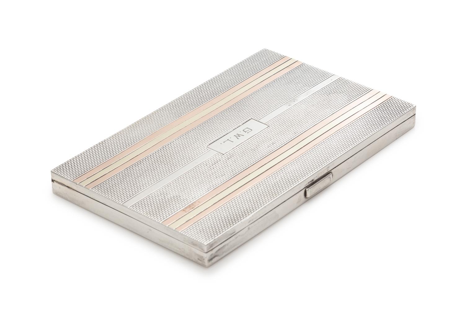 An English Silver and 14-Karat Gold Cigarette Case, Alfred Dunhill, London, the engine turned case having a rose and yellow gold banded