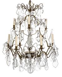 A French Brass and Glass Nine-Light Chandelier Height 37 x diameter 32 inches.