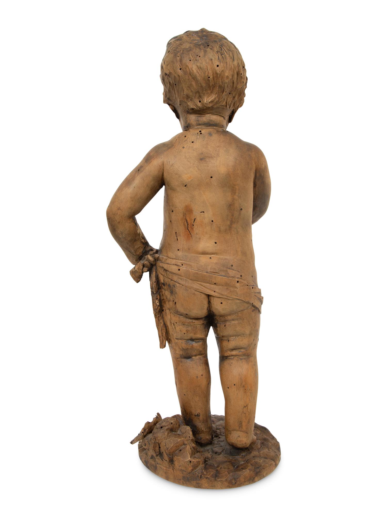 A Flemish Carved Wood Putto