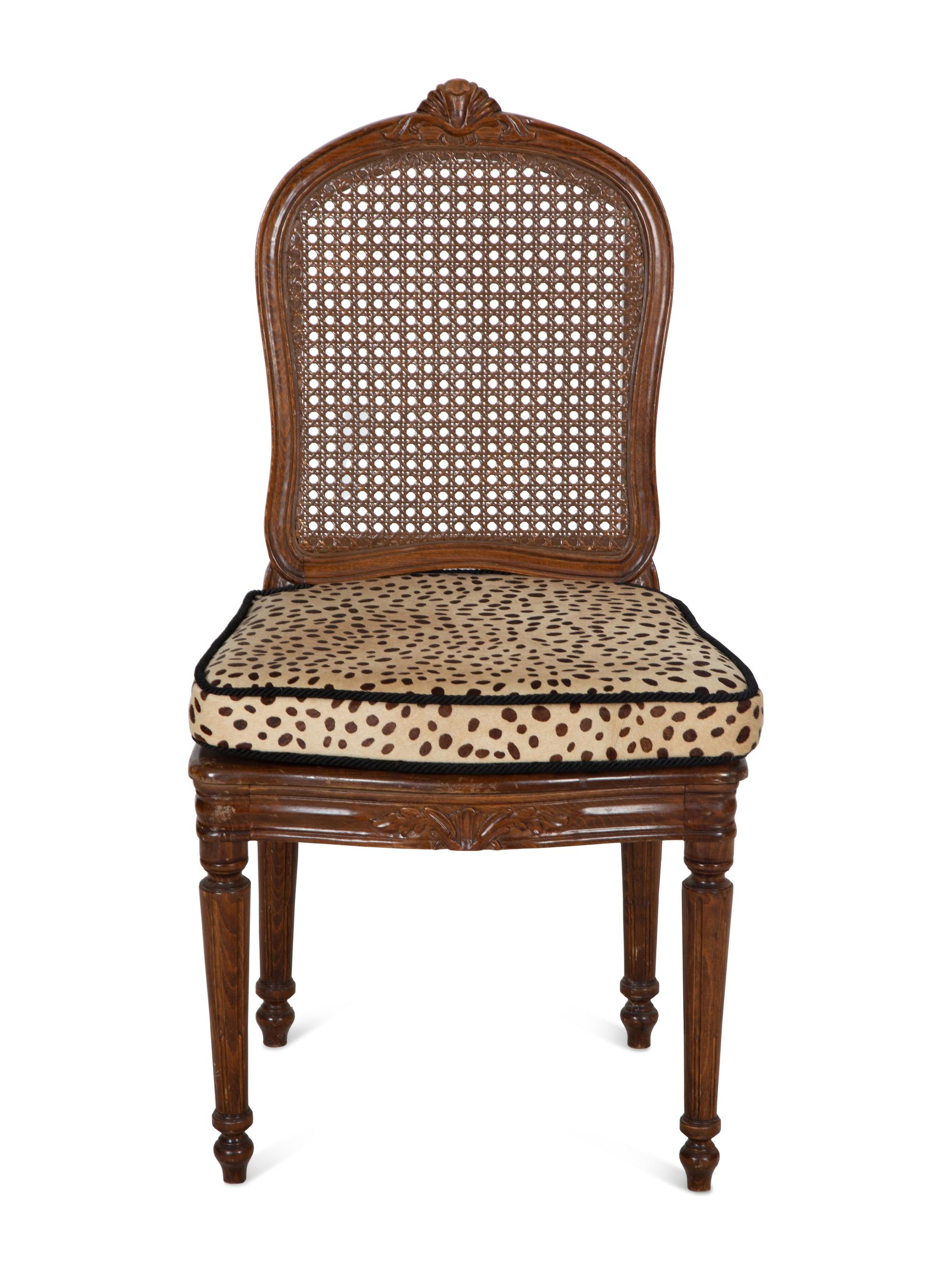 A Set of Four Regency Style Mahogany Cane Seat Dining Chairs
