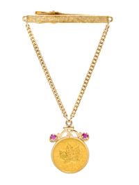 A Goldtone, 14 Karat Yellow Gold, Canadian $10 Coin and Ruby Tie Clip, 11.30 dwts.