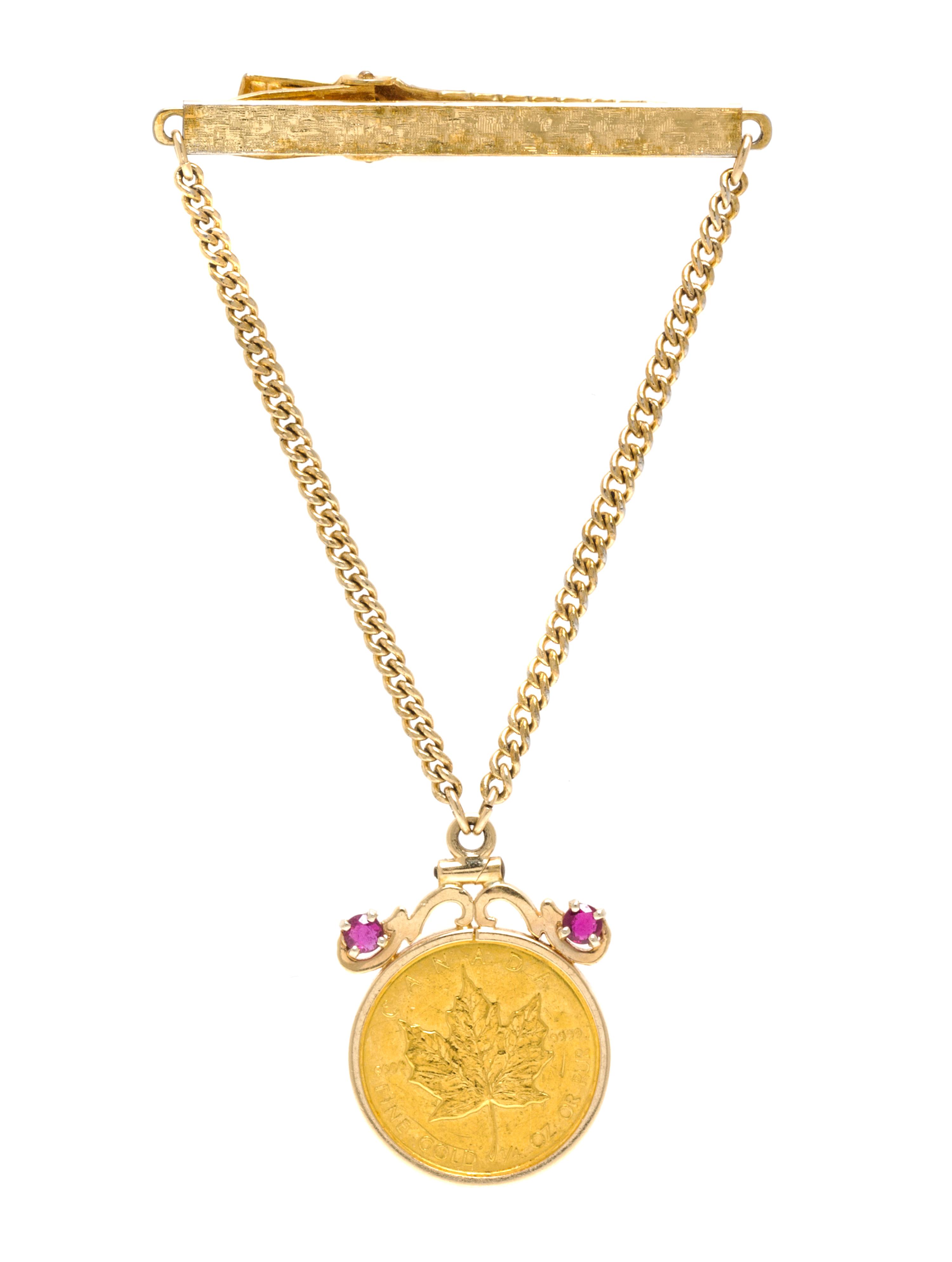 A Goldtone, 14 Karat Yellow Gold, Canadian $10 Coin and Ruby Tie Clip, 11.30 dwts.