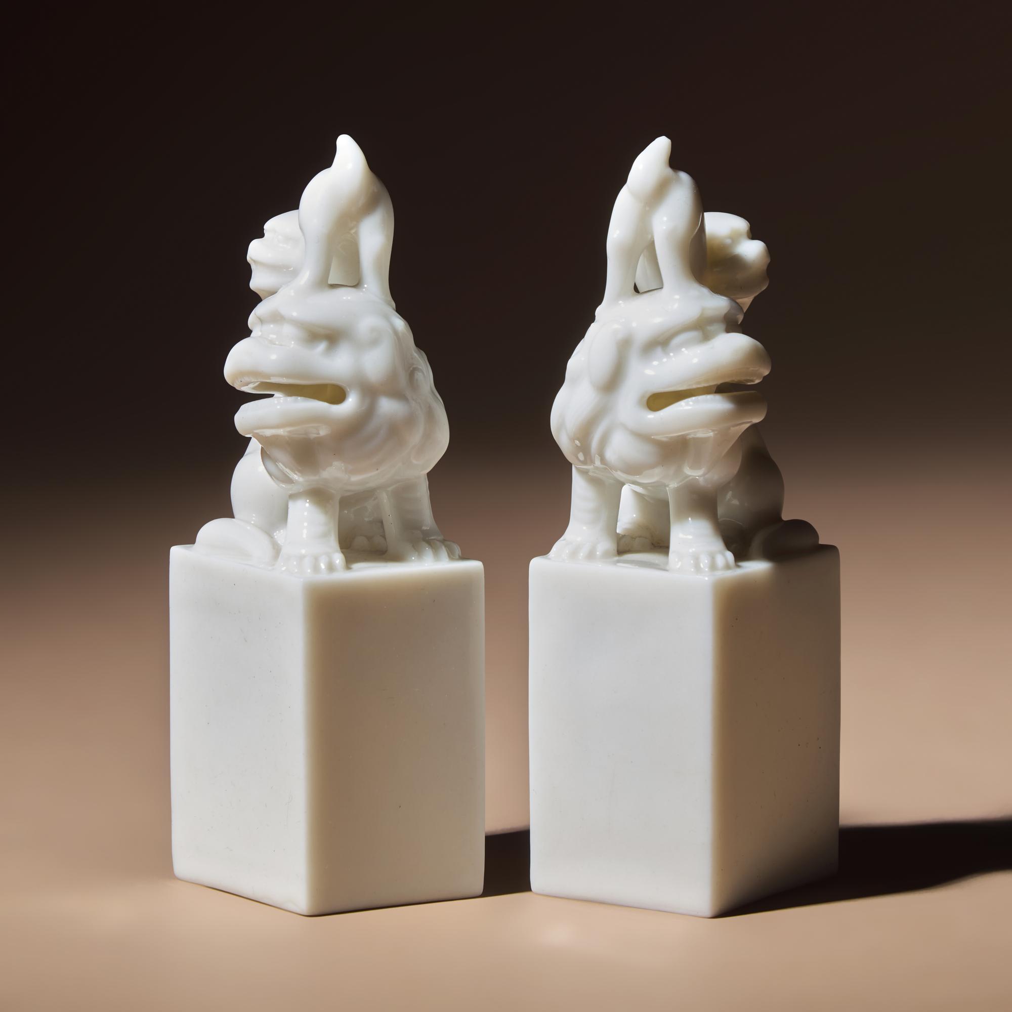 A Pair of Chinese Blanc-de-Chine Porcelain Fu Lion Seals, 18th/19th Century — 清中期 德化白瓷太獅少獅印章一對