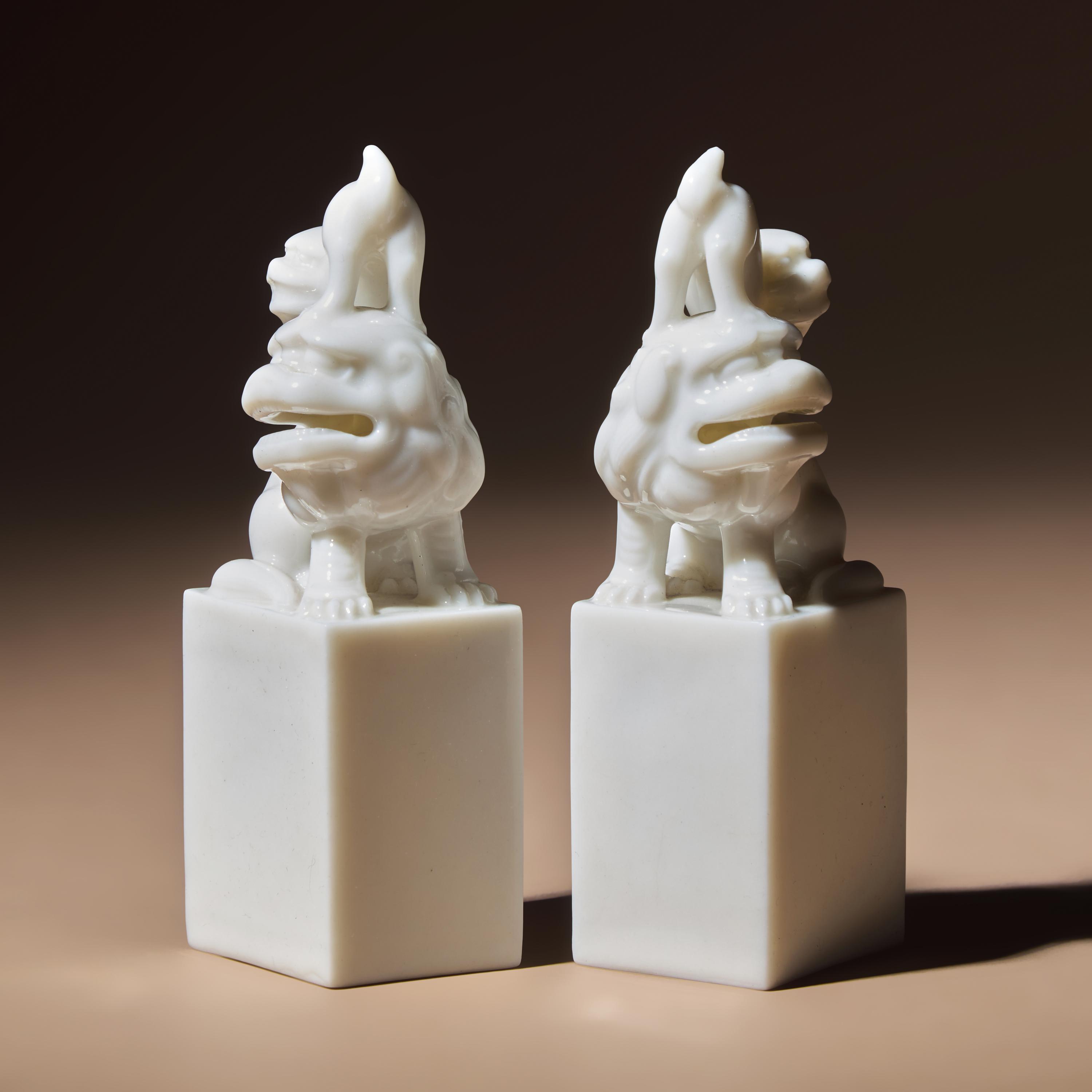 A Pair of Chinese Blanc-de-Chine Porcelain Fu Lion Seals, 18th/19th Century — 清中期 德化白瓷太獅少獅印章一對