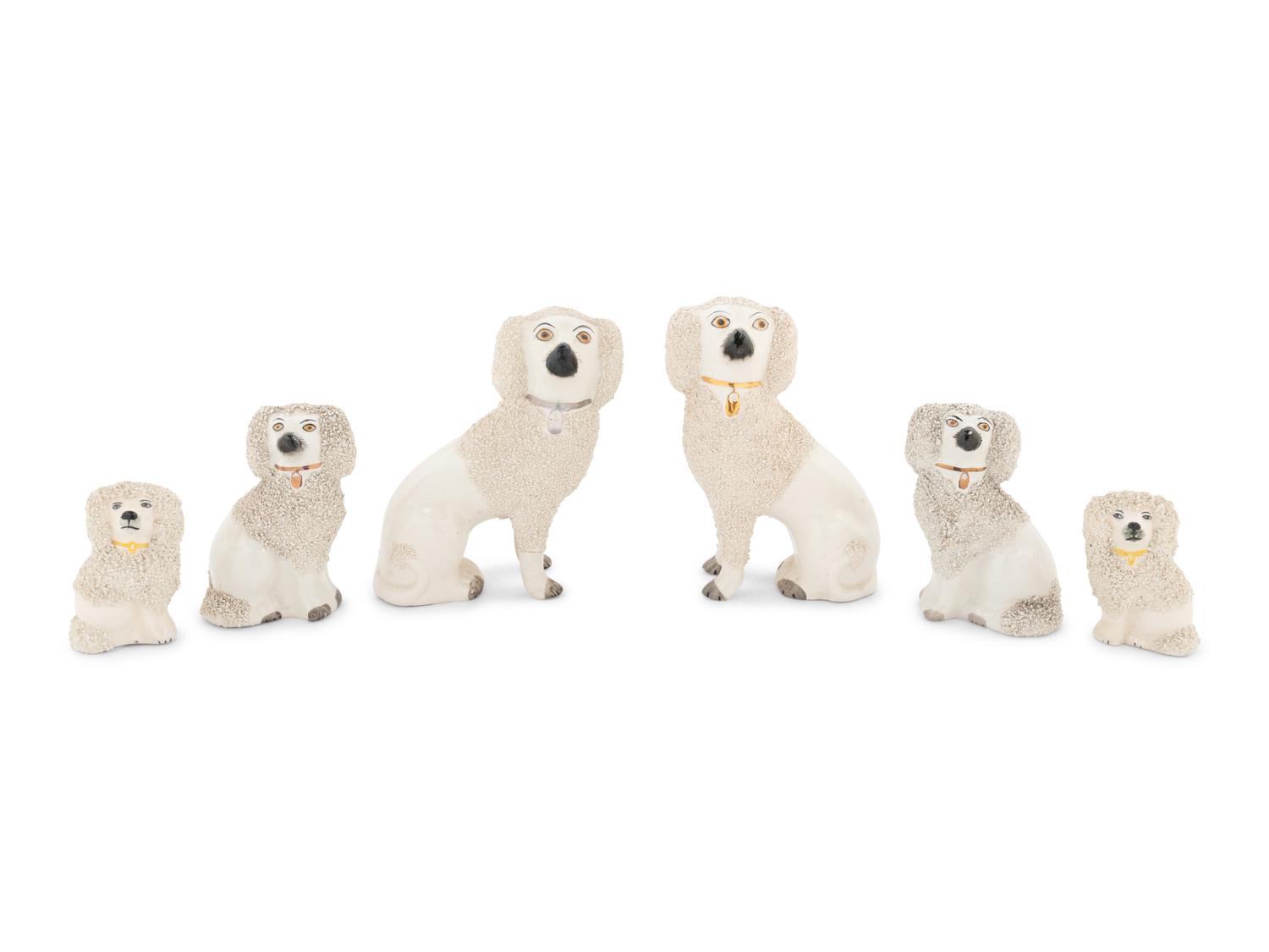 A Collection of Nine Staffordshire Glazed Poodles