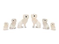 A Collection of Nine Staffordshire Glazed Poodles